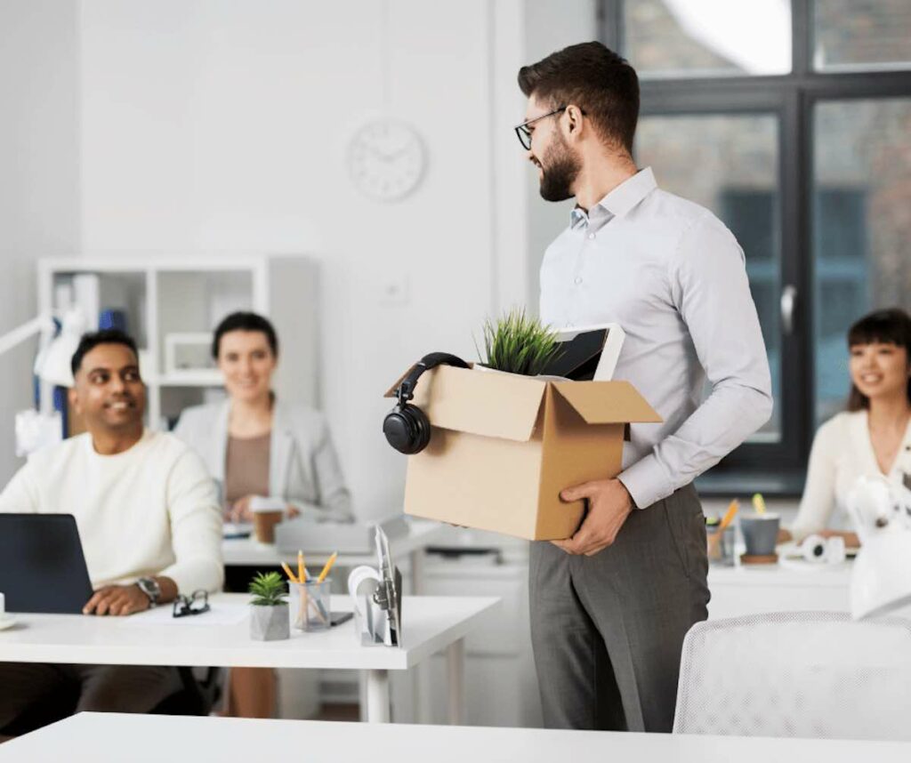 Man leaving office with work stuff.