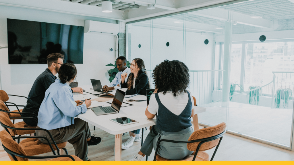 people sitting around a desk having a meeting